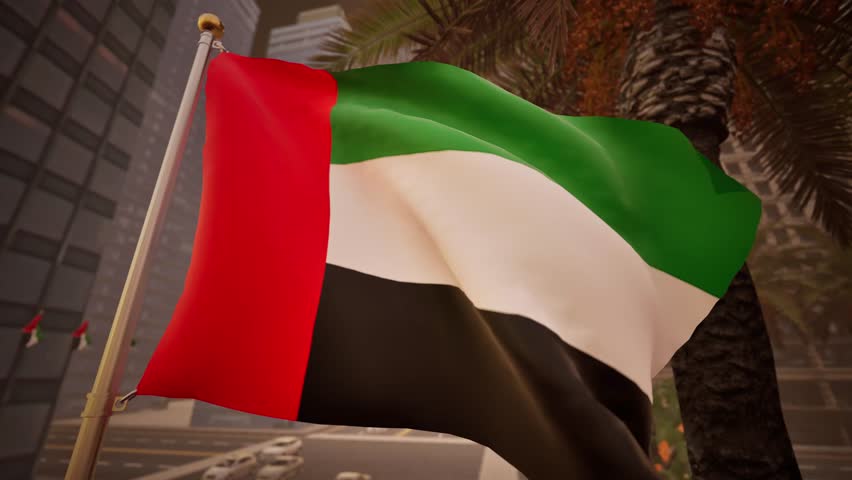 United Arab Emirates national flag waving with warm morning sunlight illuminating buildings, palm trees and active streets in a modern urban district. The early hours bring a crisp, fresh quality to the atmosphere, enhancing the vividness of the red, green, white, and black hues on the banner. As the textile flutters in the gentle dawn breeze, the rising sun casts long, sharp shadows across the architecture of the metropolis. The ensign serves as a dynamic foreground element, contrasting with the steel and glass structures of the skyline. Below, the city wakes up, with vehicles beginning their daily commute along the palm-lined avenues. This footage signifies new beginnings, optimism, and the industrious spirit of the Gulf region. The standard is displayed prominently, reflecting the pride of the nation as business and commerce commence for the day. The fabric catches the clean solar rays, revealing the intricate weave of the material. This clip is ideal for morning news broadcasts, economic reports, or travel logs showcasing the vibrant life of Dubai or Abu Dhabi. The undulation of the emblem is rhythmic and soothing, providing a steady visual anchor. The background features a blurred yet recognizable array of high-rises, establishing the location as a major hub in the Middle East. Whether used for Independence Day tributes or corporate presentations, the pendant conveys stability and progress. The interaction between the natural light and the man-made environment creates a polished, professional look. Editors seeking high-definition content with a positive, energetic tone will appreciate the clarity and composition of this scene. The symbol remains the focal point, embodying the heritage and future aspirations of the country.