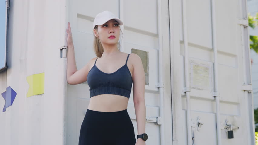 Exercise woman, young athlete enjoys sport lifestyle, outdoors city, yoga fitness model posing in workout gear, showcasing healthy active habits, clean urban backdrop. - Powered by Shutterstock - Get 15% off with code: PIKWIZARD15