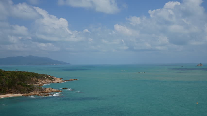 Tropical beautiful landscape of sea ocean around sand with white cloud blue sky for nature background
