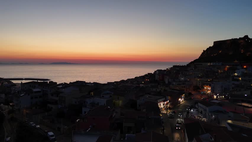 Sunset over Castelsardo, Sardinia, showing vibrant colors and tranquility