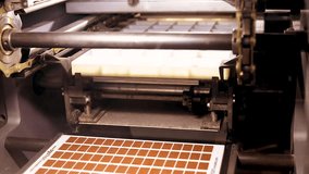 Chocolate candy-making technology at a chocolate factory, mold press machine - Powered by Shutterstock - Get 15% off with code: PIKWIZARD15