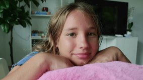 Female student takes nap during lunchtime during her extra classes at school leaning pillow placed on her desk in an international school classroom smiling gently and friendly at the camera. - Powered by Shutterstock - Get 15% off with code: PIKWIZARD15