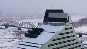 Real time aerial of iconic Riga architecture and frozen cityscape in snowfall - Powered by Shutterstock - Get 15% off with code: PIKWIZARD15