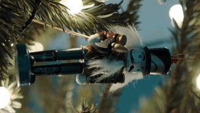 Decoration Toys on Christmas Tree. 4K Shot. Nutcracker Soldier , Vintage Robot on a Christmas Tree With Blurred Background. Beautiful Decorated Christmas Tree the Fairy Lights. Rack Focus - Powered by Shutterstock - Get 15% off with code: PIKWIZARD15