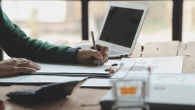 Hands, person and typing on laptop with graphs documents, data analysis and financial report. Accountant, paperwork for finance growth, investment statistics. bookkeeping. book Notebook paper writing - Powered by Shutterstock - Get 15% off with code: PIKWIZARD15