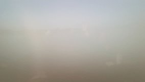 Ascending through morning fog, rooftops and a classic church tower of a German old town gradually emerge, surrounded by forested hills. - Powered by Shutterstock - Get 15% off with code: PIKWIZARD15