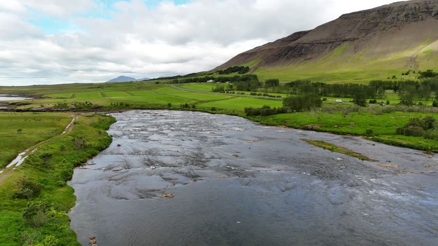 Aerial view of Hvalfjörður fjord in Vesturland Iceland, showing calm waters, surrounding mountains, and expansive Icelandic landscape from above.