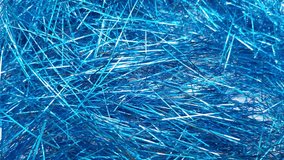 Stop motion Blue foil tinsel background, Shimmer shiny blue tinsel shred festive, wedding, birthday party, Christmas decorations. - Powered by Shutterstock - Get 15% off with code: PIKWIZARD15