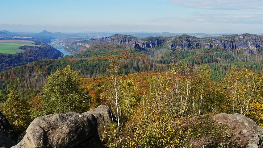 Amazing views of Saxon Switzerland National Park in Germany, featuring dramatic rock formations and the Elbe River in breathtaking natural landscape.
