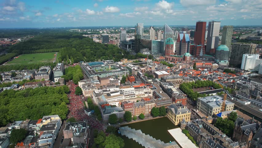 The Hague Skyline view of Free Palestine mass protest, aerial shows massive group of protesters around Dutch Parliament Tweede Kamer in The Hague, Netherlands