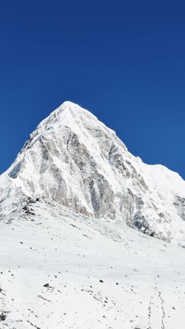 Himalayas under the clouds, UGC, majestic views of the snowy mountains, nature background of a Himalayan mountain range covered with white snow, rocky terrain valley, stone mountains.