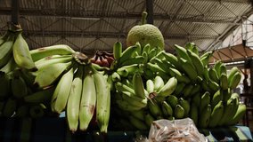 Explore a vibrant tropical fruits market stall with fresh bananas in focus - Powered by Shutterstock - Get 15% off with code: PIKWIZARD15