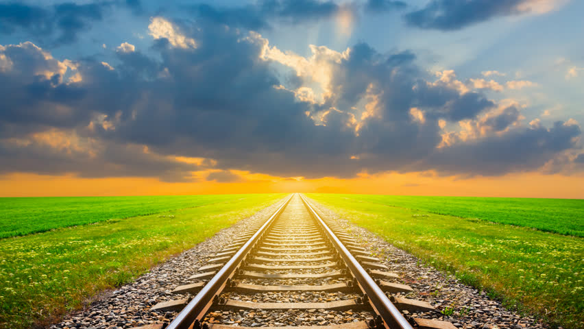 railway leaving far away at the dramatic sunset time lapse scene