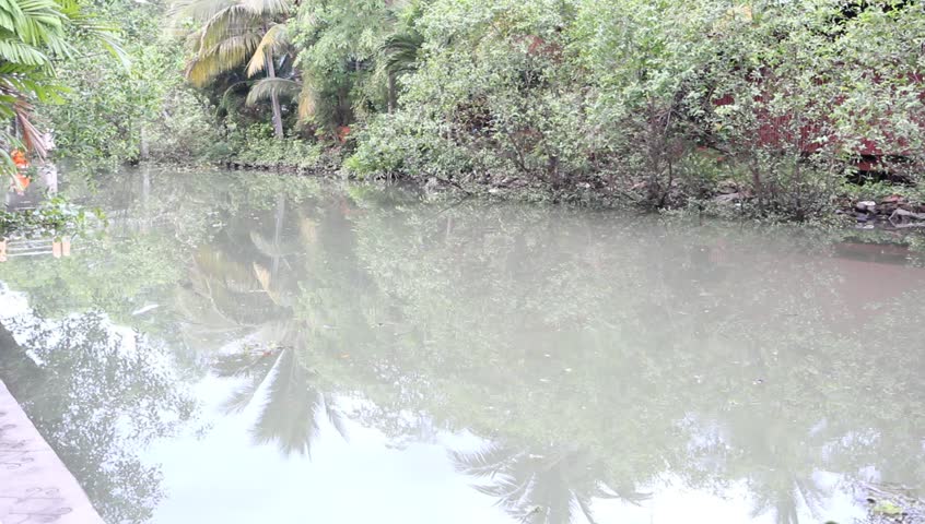 AMPHAWA, THAILAND - APRIL 2013 : Buddhist monks in boat  go to get food and drink from people along the river