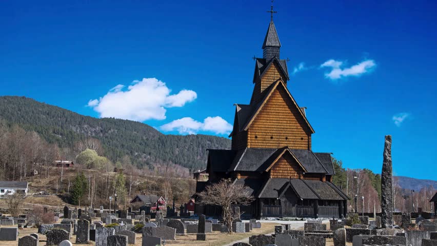 A panoramic view of an old church in a graveyard located in NorvegiaHeddal medieval wooden stave church in Telemark NorwayHeddal Church Norway