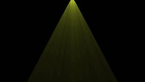 A vibrant golden yellow spotlight beam cuts through darkness, creating atmospheric rays on a black background. Perfect for highlighting, intros, or dramatic effects. - Powered by Shutterstock - Get 15% off with code: PIKWIZARD15