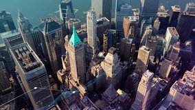 Aerial view of a financial district showing urban network technology. Glowing lines illustrate data streaming through futuristic smart city - Powered by Shutterstock - Get 15% off with code: PIKWIZARD15