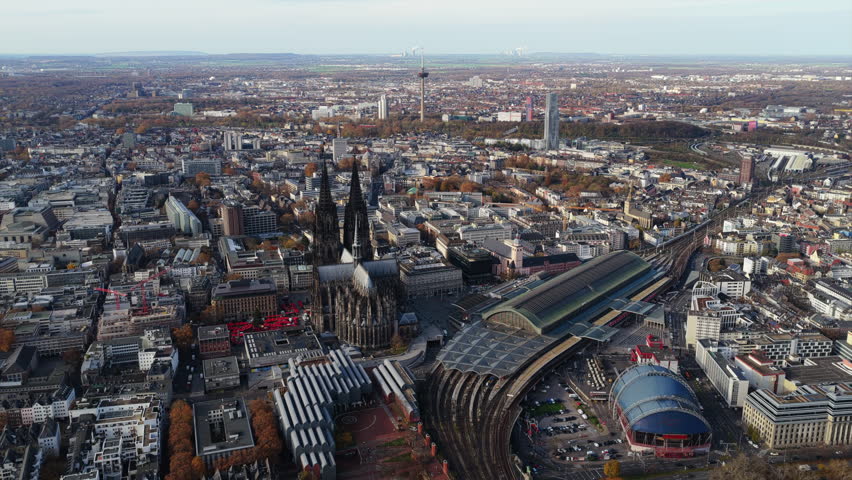 Aerial cityscape of Cologne, Germany, showing gothic Cathedral, Hauptbahnhof central train station, and city skyline