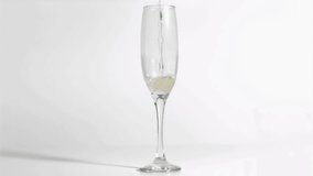 Tall champagne flute receiving pale pouring from above causing red hearts rising beside evoking joy. Glass, bubbles, flow, animation, romance, celebration, minimal - Powered by Shutterstock - Get 15% off with code: PIKWIZARD15