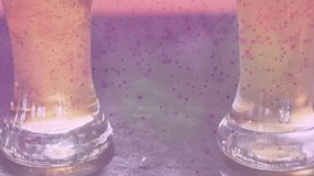 Speckled overlay appearing, camera revealing two pint glasses filling, foaming, showing carbonation. Tumbler, amber, bubbles, reflections, bar, studio, minimalist - Powered by Shutterstock - Get 15% off with code: PIKWIZARD15
