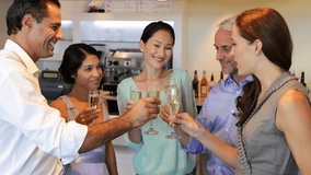 Five adults toasting, raising flutes and clinking, sparking hearts overlaying frame for marketing. Champagne, celebration, camaraderie, bar, gathering, social, cheers - Powered by Shutterstock - Get 15% off with code: PIKWIZARD15