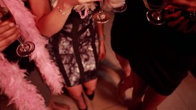 Close-up hands raising flutes, women clinking at bar, hearts multiplying for nightlife party. Bride, bachelorette, friends, celebration, lounge, neon, cocktails - Powered by Shutterstock - Get 15% off with code: PIKWIZARD15