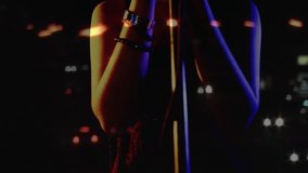 Woman singer lowering hands, bringing mouth to mic, singing music while bokeh drifting across watch. Female, vocalist, stage, performance, silhouette, lighting, studio - Powered by Shutterstock - Get 15% off with code: PIKWIZARD15