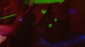 Woman adjusting strap as camera zooming, male singer moving to mic singing music amid projections. Vocalist, stage, band, lighting, projection, live, performance - Powered by Shutterstock - Get 15% off with code: PIKWIZARD15