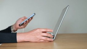 Businesswoman using laptop and smartphone, remote work concept. Modern office desk with technology for online work, productivity and communication in professional digital workplace.

 - Powered by Shutterstock - Get 15% off with code: PIKWIZARD15