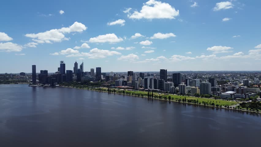 Aerial Perth, Western Australia City Skyline footage. Panoramic views of the city, the Swan River, South Perth and the southern suburbs. Central business district and sports fields. 