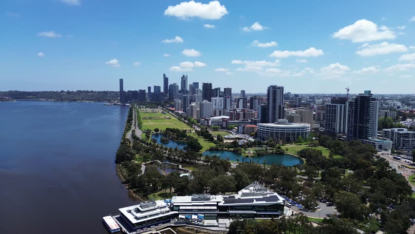Aerial Perth, Western Australia City Skyline footage. Panoramic views of the city, the Swan River, South Perth and the southern suburbs. Central business district and sports fields. 