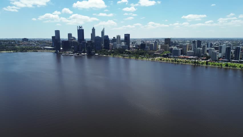 Aerial Perth, Western Australia City Skyline footage. Panoramic views of the city, the Swan River, South Perth and the southern suburbs. Central business district and sports fields. 