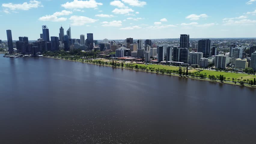 Aerial Perth, Western Australia City Skyline footage. Panoramic views of the city, the Swan River, South Perth and the southern suburbs. Central business district and sports fields. 
