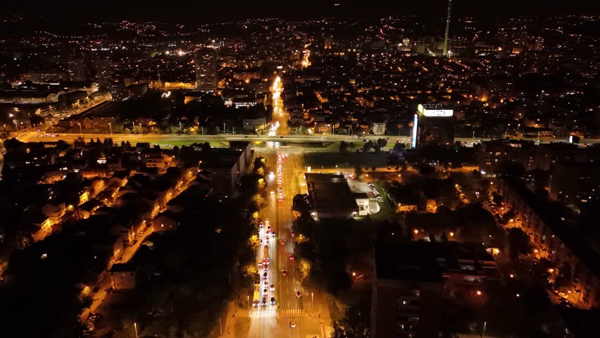 Aerial night view of Zagreb streets, avenues, crossroads, Tresnjevka district. Traffic, city lights, night panorama.