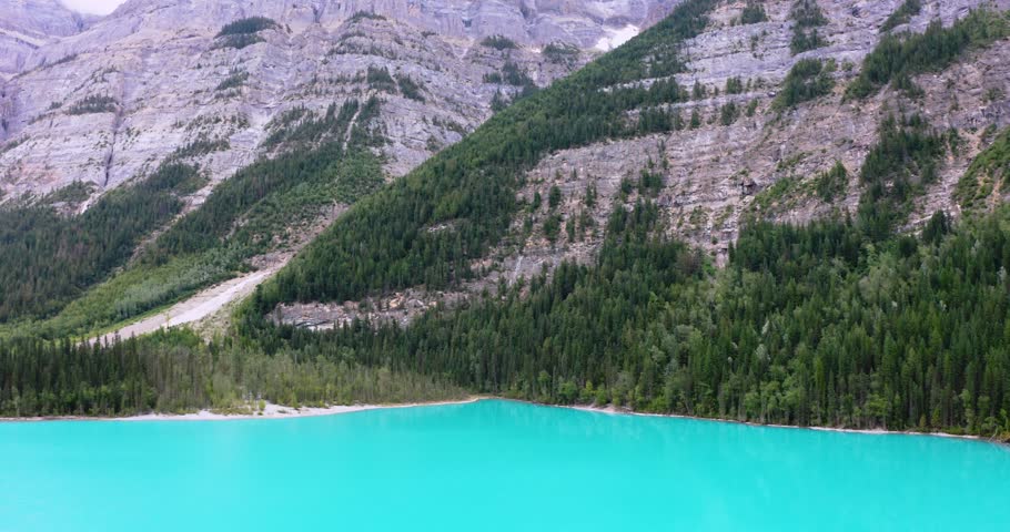 Spectacular drone footage of turquoise Kinney Lake with Mount Robson rising dramatically in the background. Captures the beauty of the Canadian Rockies and one of the region’s most scenic hiking route