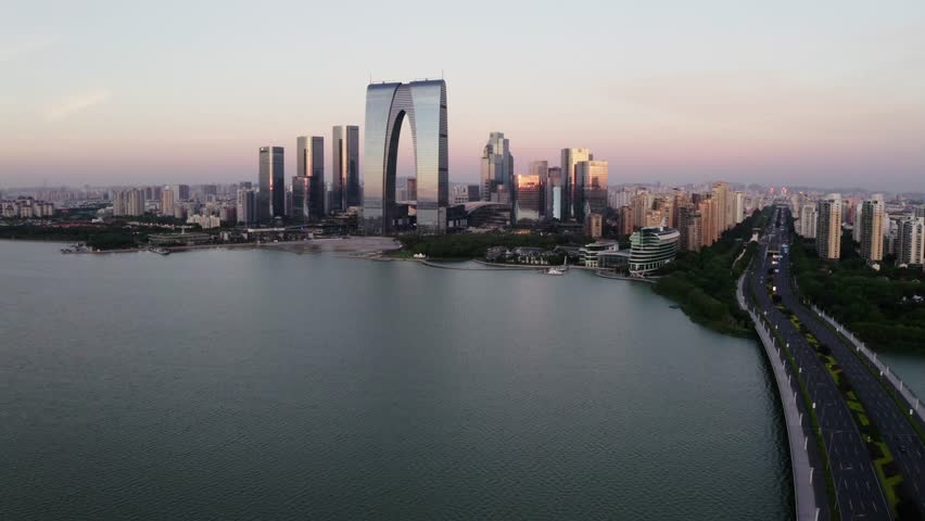 CBD buildings by the lake. Aerial in Suzhou, China 4k