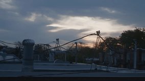 Industrial Rooftop With Large Ventilation Pipe With Wires And Cables At Dusk. - static shot - Powered by Shutterstock - Get 15% off with code: PIKWIZARD15