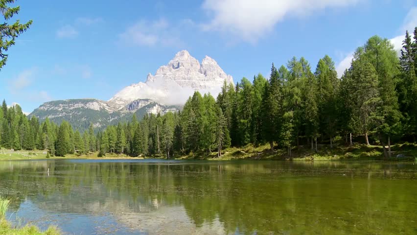 Scenic view of Tre Cime di Lavaredo mountain reflected in lake Misurina water