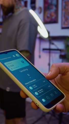 Vertical cropped shot of hand of unrecognizable client sending money for service standing in parlor