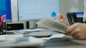 Close-up of a woman doing accounting at a desk, using a computer for data analysis and financial work, highlighting office, business, and finance visuals. - Powered by Shutterstock - Get 15% off with code: PIKWIZARD15