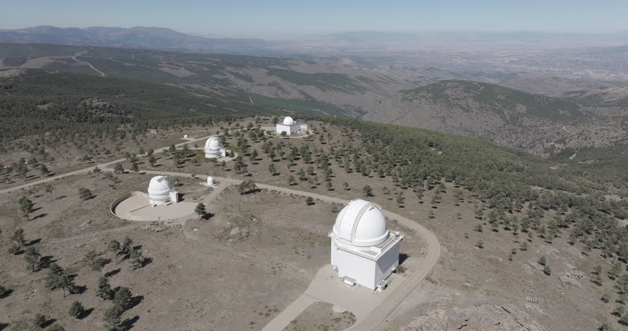 Aerial drone shot towards Calar Alto Observatory in the Sierra de Los Filabres mountain range in Almeria, Andalusia, Spain. Largest astronomical observatory in Europe