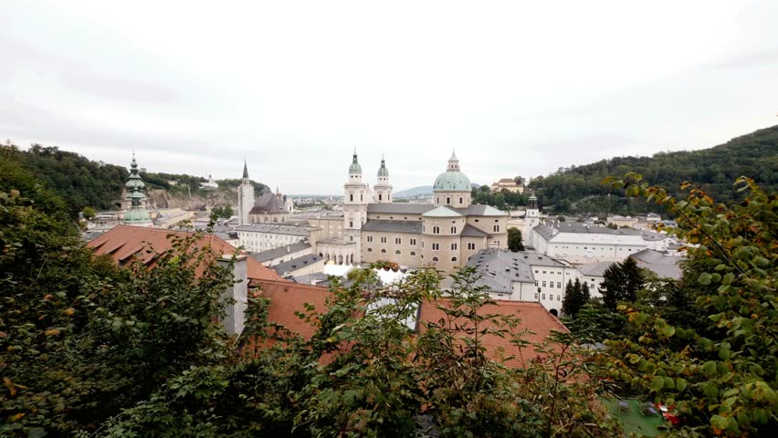 Scenic view of Salzburg Austria featuring historic architecture and green hills