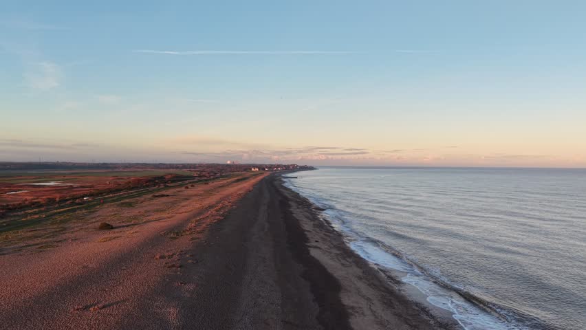 Deserted shingle beach Aldeburgh Suffolk UK golden hour drone,aerial