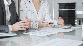 Business partners analyzing corporate data during a meeting, discussing financial reports and market trends. Business-people concept - Powered by Shutterstock - Get 15% off with code: PIKWIZARD15