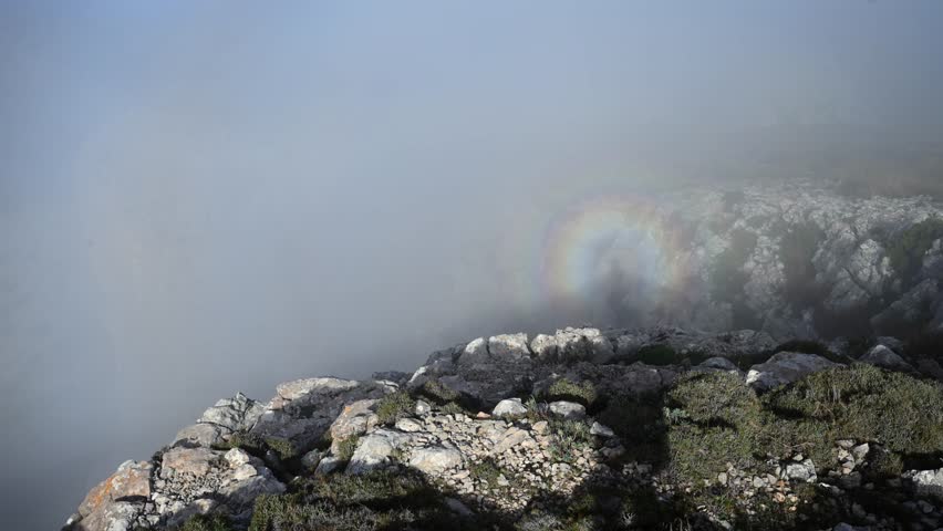 Above the World: Active Female Hiker Standing High Above a Cloud Inversion in the Rugged Tramuntana Mountains of Mallorca, Spain