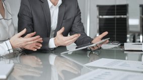 Business people hands discussing data on digital tablet during an office meeting, planning strategy and analyzing results - Powered by Shutterstock - Get 15% off with code: PIKWIZARD15