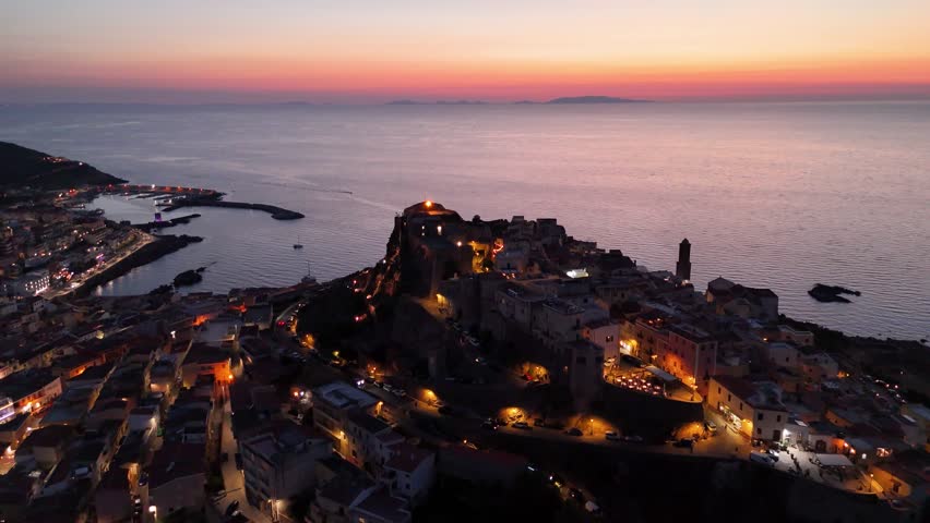 Sunset over Castello dei Doria, Sardinia, peaceful coastal view