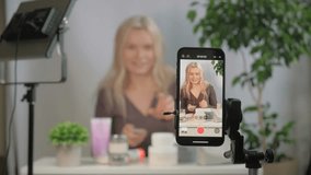 Face, makeup influencer or vlog with girl, spray or advice with content creator, promotion for cosmetics product or live streaming. Portrait, person or woman with item for skincare or record tutorial - Powered by Shutterstock - Get 15% off with code: PIKWIZARD15