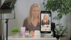 Face, beauty vlogger or influencer with girl, using spray or giving tips as content creator, promotion for skincare product or live streaming. Portrait, woman or person with item for makeup tutorial - Powered by Shutterstock - Get 15% off with code: PIKWIZARD15