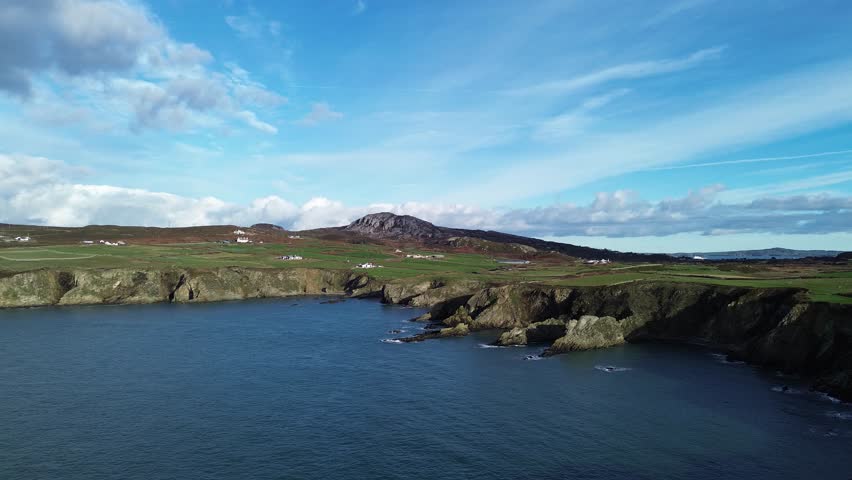 Holyhead mountain rugged welsh coastline aerial view establishing remote headland lighthouse